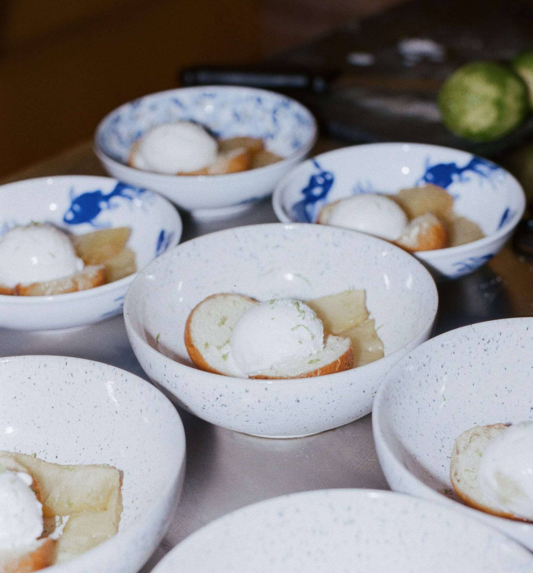 Delicate dessert bowls with ice cream and lime
